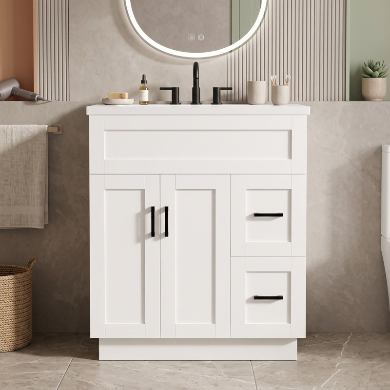 Meuble-lavabo avec lavabo en résine, 2 tiroirs à fermeture amortie, tablette réglable et dos ouvert pour faciliter l'accès à la plomberie.