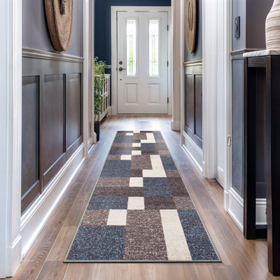 Tapis bleu touffeté à motif géométrique Allyne