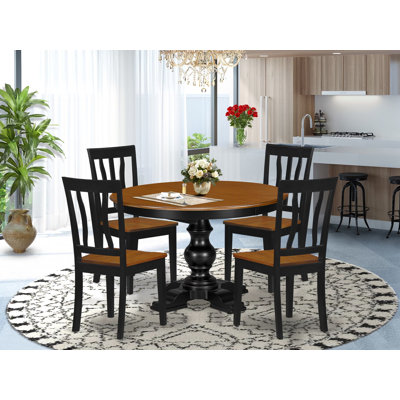 L'ensemble de salle à manger moderne 5 pièces se compose d'une table et de 4 chaises modernes avec dossier à lattes - noir