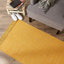 Tapis doré en coton Cordele-818801616