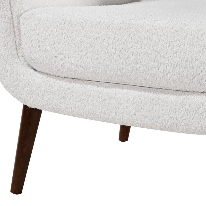 Fauteuil Boucle, pieds en bois massif, coussin en mousse amovible, accoudoir blanc, assise, structure