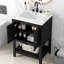 Meuble-lavabo moderne noir avec tablette ouverte et lavabo en céramique