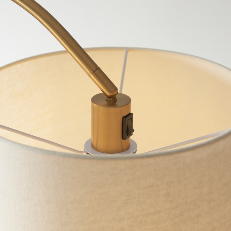 Thackinh Floor Lamp finished in Warm Brass and Cream