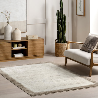 Sonali Casual Bordered Fringe Area Rug