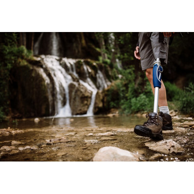 Guy with disability walking on stream Wall Art on Canvas
