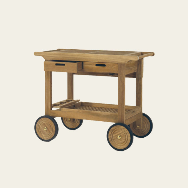 Outdoor wooden serving cart with two wheels, two drawers, and a lower slatted shelf.