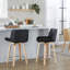 Tabouret de bar pivotant à hauteur fixe de 61 cm (24 po) de style moderne du milieu du siècle, en bois de zèbre et similicuir noir, avec repose-pieds rond en métal chromé - Ensemble de 2-134889570