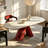 70.47" Modern Oval Marble Dining Table with Sculptural Red Stainless Steel Base for 6-8 People