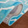 Tapis ivoire / turquoise en laine touffeté à la main à motif géométrique