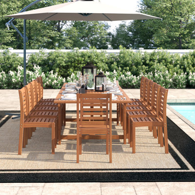 Anautica 12 - Person Solid Wood Patio Dining Set Extendable and Umbrella Hole Included Rectangular Table