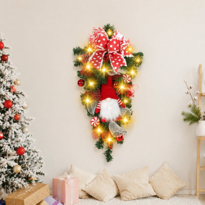 Guirlande de Noël illuminé en forme de goutte avec gnome pelucheux, guirlande de Noël artificielle 27,5 pouces avec ornements de bonbons à pois rouges pour la porte des Fêtes