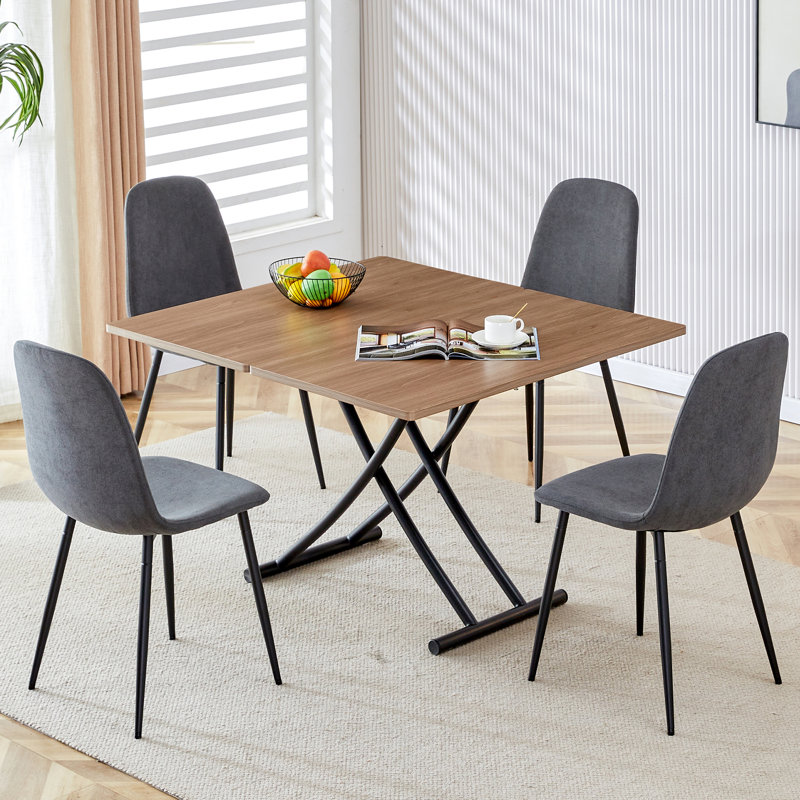 Ensemble multifonctionnel de table et de chaises pour diverses occasions avec un design relevable et des chaises confortables