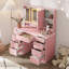 Meuble-lavabo à trois tiroirs rose avec miroir et DEL