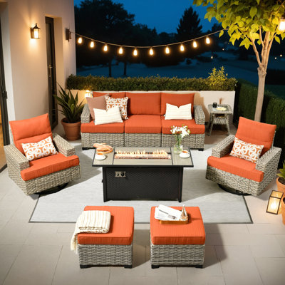 7- Person Rattan Outdoor Seating Group With Swivel Rockers and Fire Pit Table