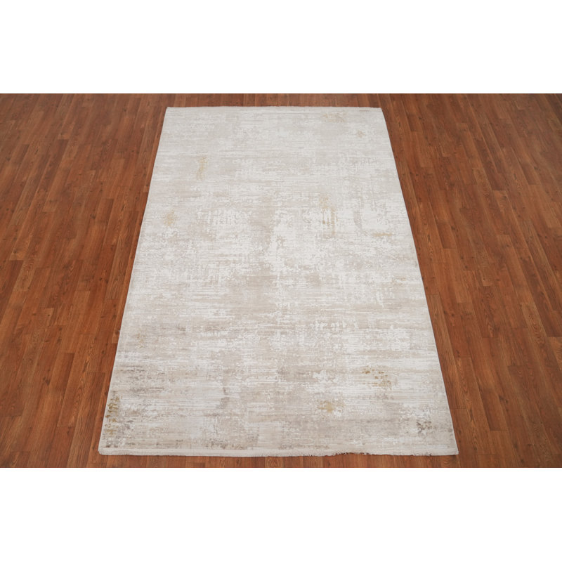 Élégant tapis minimaliste 5 x 7 avec un motif texturé subtil