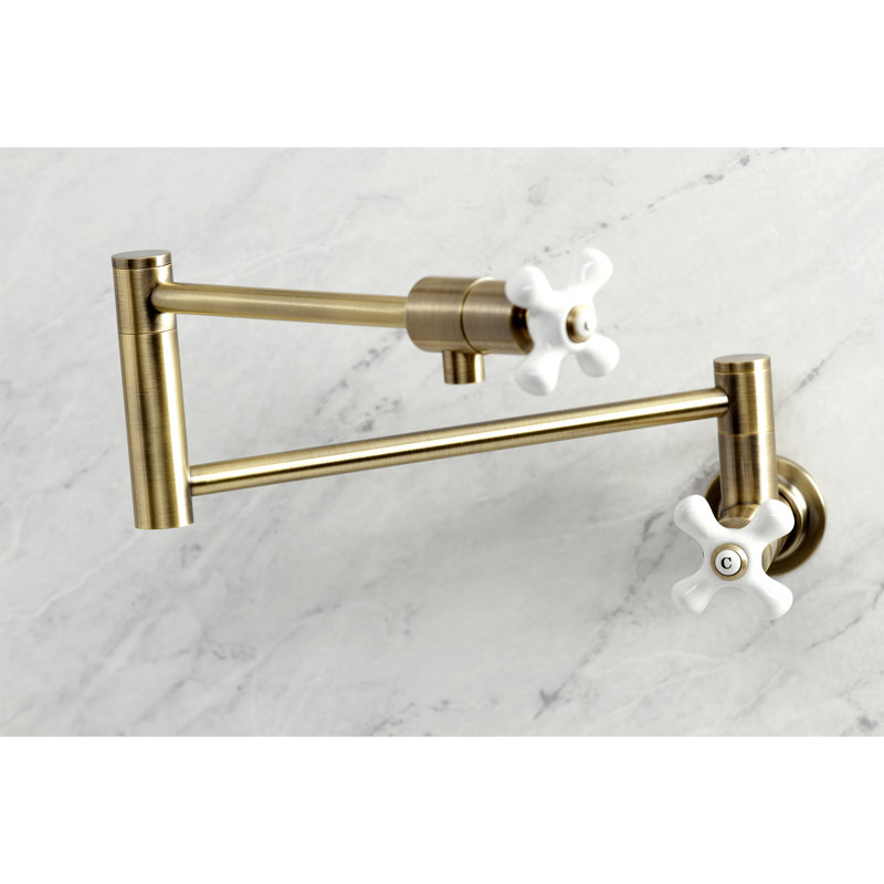 Kingston Brass Manhattan Two-Handle 1-Hole Wall Mount Pot Filler Faucet, Antique Brass/White, Cross