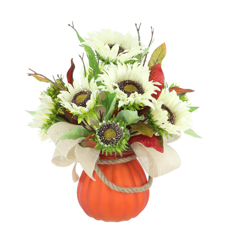 Fall Arrangement with Sunflowers and Magnolia Leaves in Pumpkin Vase