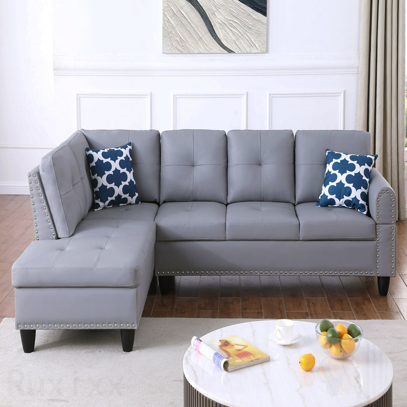 Canapé modulaire en similicuir avec repose-pieds