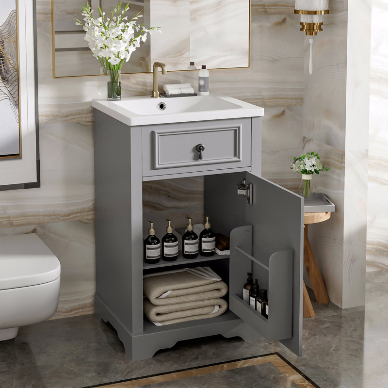Meuble-lavabo de 20 po avec lavabo en céramique, porte à fermeture douce, tablette réglable et support de rangement fixé à la porte
