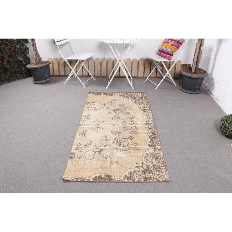 Vintage Handwoven Turkish Rug with Unique Beige Floral Design Made from Wool