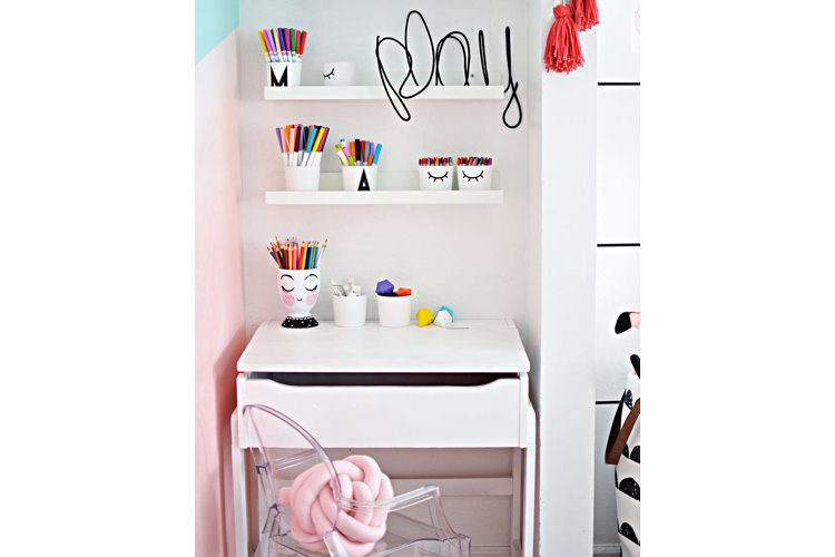 A white bedroom with pink accents