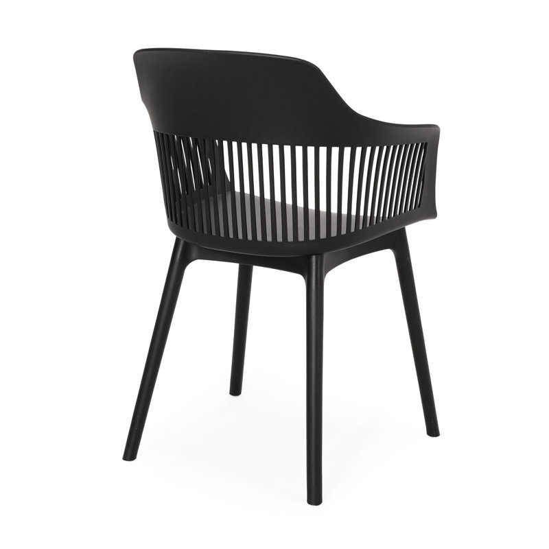 Dahlia Chair - Outdoor Use. Black Polypropylene, . Modern Style. 33''H X 22.5''W 21.5''D. And Stable Minimalist Lines Curves.
