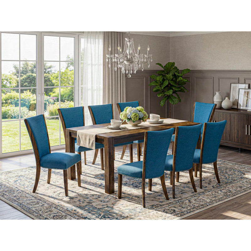 Cet ensemble de salle à manger 9 pièces comprend une table de salle à manger rectangulaire en bois rustique et 8 chaises Parson rembourrées en tissu de couleur bleue