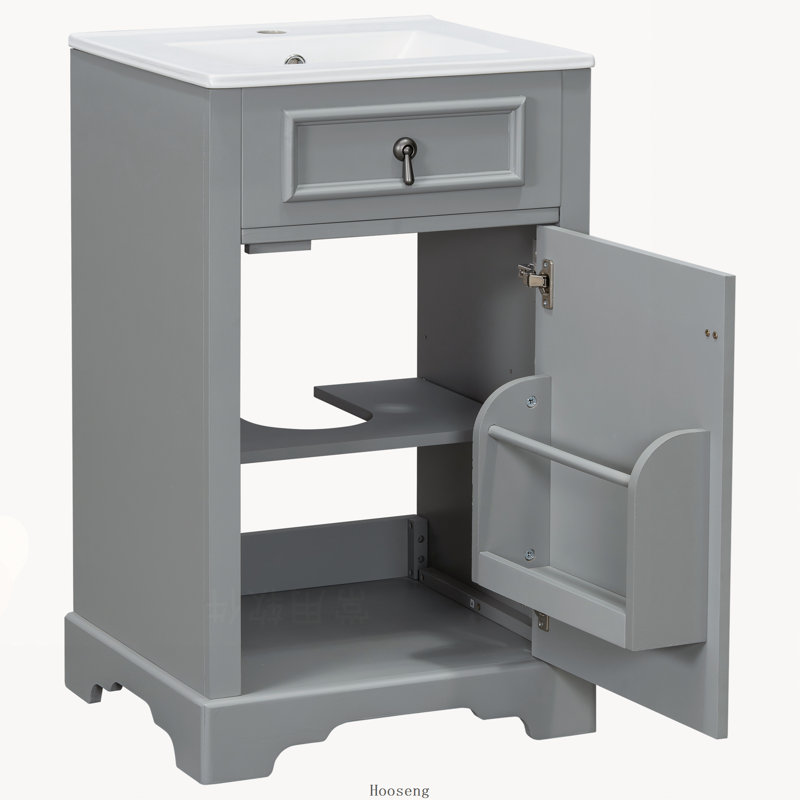 Meuble-lavabo de 50 cm avec lavabo en céramique, porte à fermeture amortie, tablette réglable et tablette de rangement intégrée à la porte.