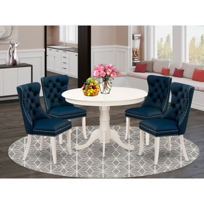 L'ensemble de table de cuisine 5 pièces comprend une table ronde avec piédestal et 4 chaises rembourrées