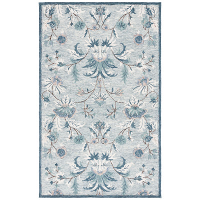 Aavni Hand Tufted Wool/Cotton Performance Floral Rug in Blue
