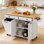 Îlot de cuisine 60 po avec rallonge et prise de courant, chariot de rangement roulant avec armoire à poubelle, support à épices et barre à serviettes, blanc