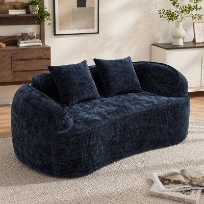 Dark Blue curved two - person compress  sofa. It has armrests on both sides, comes with two pillows, is suitable for small - sized apartments, and can be placed in the living room or bedroom