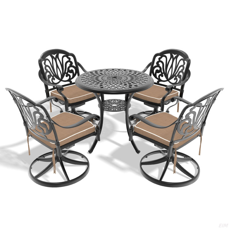 L'ensemble de salle à manger en fonte d'aluminium toutes saisons comprend des chaises pivotantes et une table avec un cadre noir