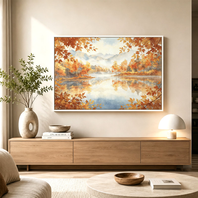 Tableau sur toile avec cadre flottant, représentant des arbres d'automne, des feuilles orangées, un lac serein et des montagnes brumeuses. Prêt à accrocher.