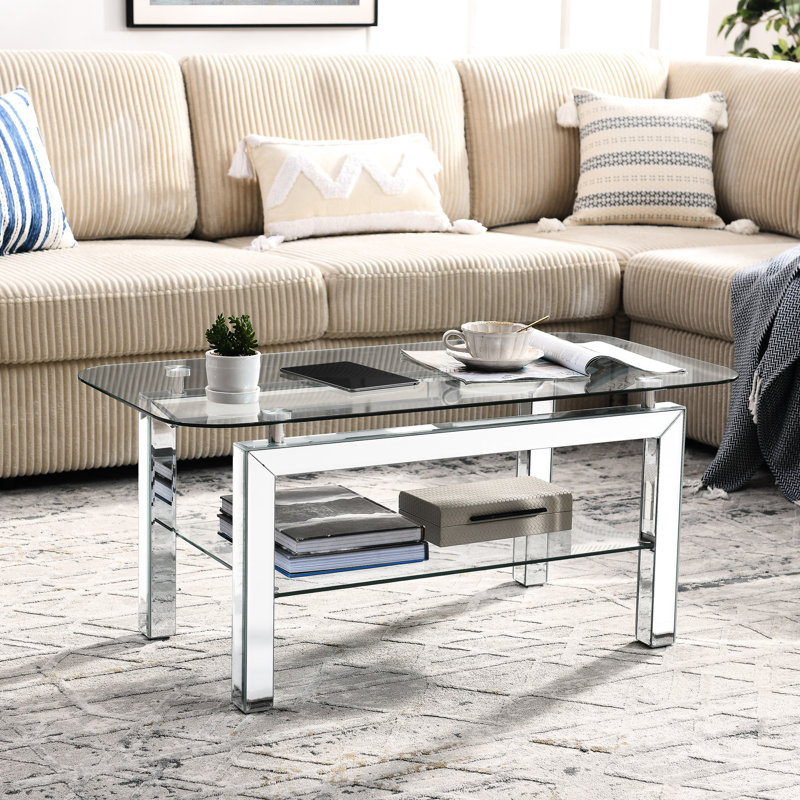 Table basse élégante en verre trempé avec tablette et pieds ovales en miroir
