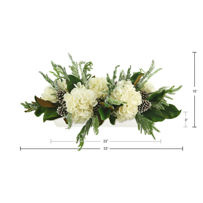 Snowy Holiday Arrangement with Hydrangeas, Magnolia Leaves and Pinecones