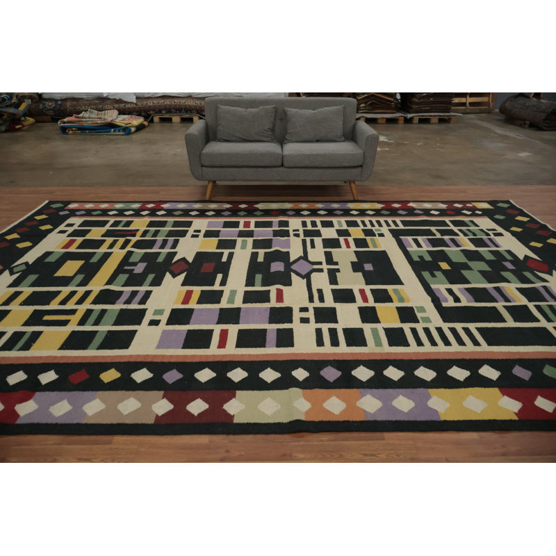 Mélange de couleurs et de formes éclatantes dans un grand tapis douillet 9 x 14