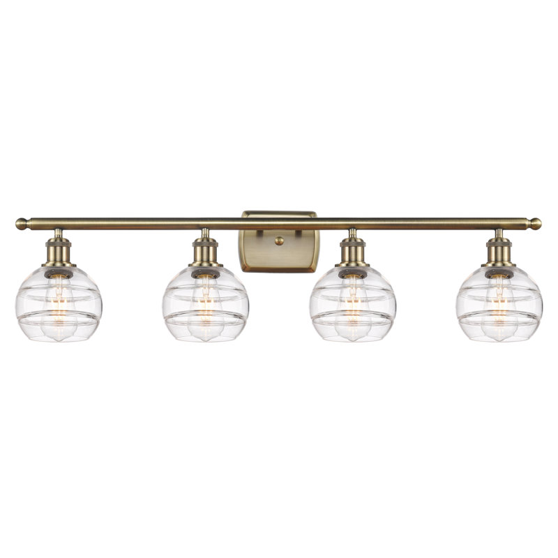 Éclairage pour meuble-lavabo à 4 lumières à intensité variable Chartoff, Transparent, Laiton antique