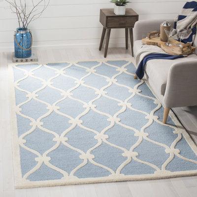 Tapis blanc / bleu en laine à motif géométrique Cannen