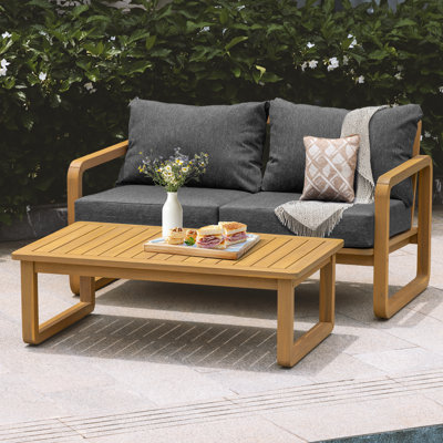 Ivy Patio Loveseat With Coffee Table and Beige Cushion by Ebern Designs