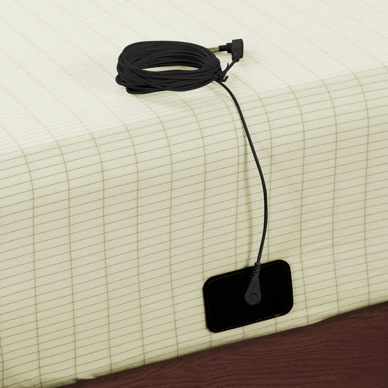 Beige cotton blend fitted sheet with a black grounding mat and cord attached