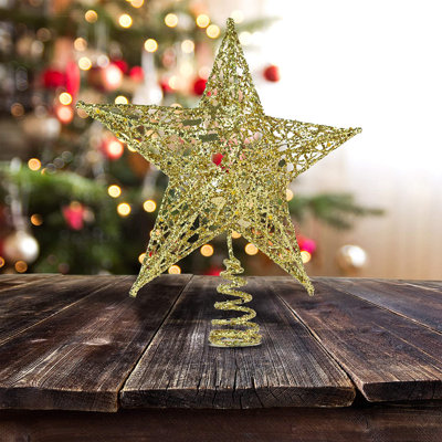 Pointe d'arbre de Noël en forme d'étoile