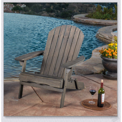 Foldable Acacia Wood Adirondack Chair With Traditional Slats, Rustic Design, And Wide Armrests For Outdoor Comfort