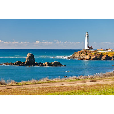 " Lighthouse Over Ocean With Rocks " by Sborisov