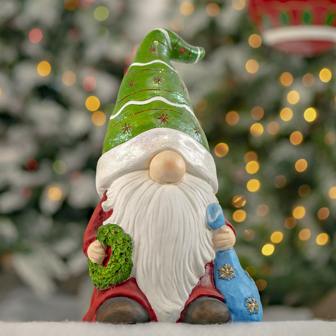 Christmas Garden Gnome Holding Blue Gift Bag with Green Hat "The Goodfellows" The Holiday Aisle®