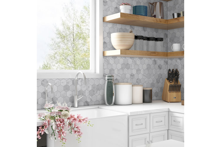 Kitchen with white marble honeycomb backsplash tiles.