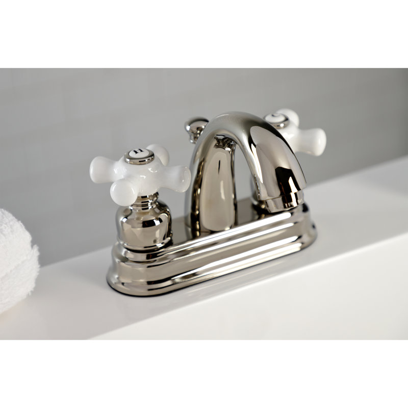 Kingston Brass Restoration Two-Handle 3-Hole Deck Mount 4" Centerset Bathroom Faucet with Plastic Pop-Up, Polished Nickel