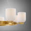 Lustre 8 lumières Isla Blanca en laiton chaud par Breegan Jane