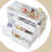 Wooden Baby Changing Table Dresser,Diaper Changing Table with Large Tabletop,4 Drawers, Open Storage Space & Side Shelves,Modern Storage Crib with Changing Table for Nurseries and Baby Rooms,White