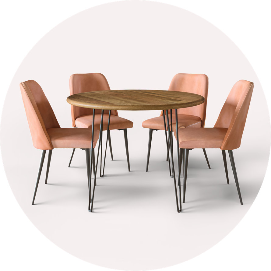 Round wood table with four upholstered chairs.